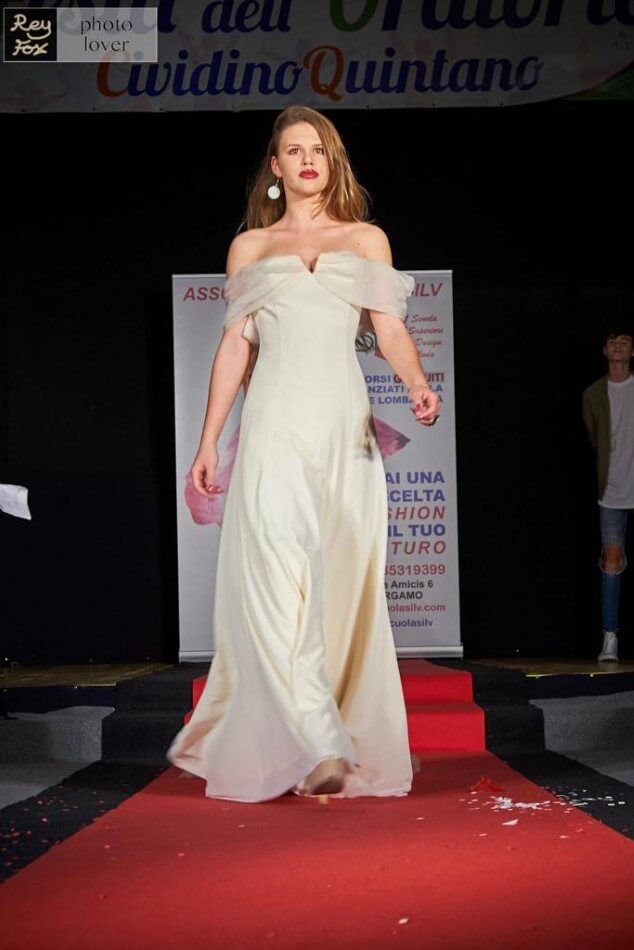 Model in elegant dress on the catwalk