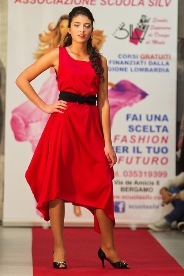 Model in elegant dress on the catwalk