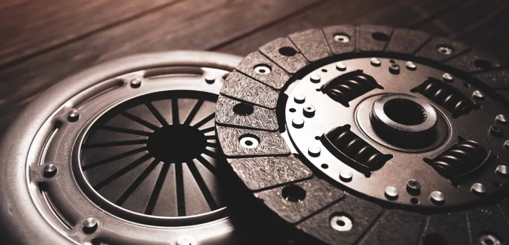 A close up of a clutch disc on a wooden table | Nate's Garage - Auto & Body Shop