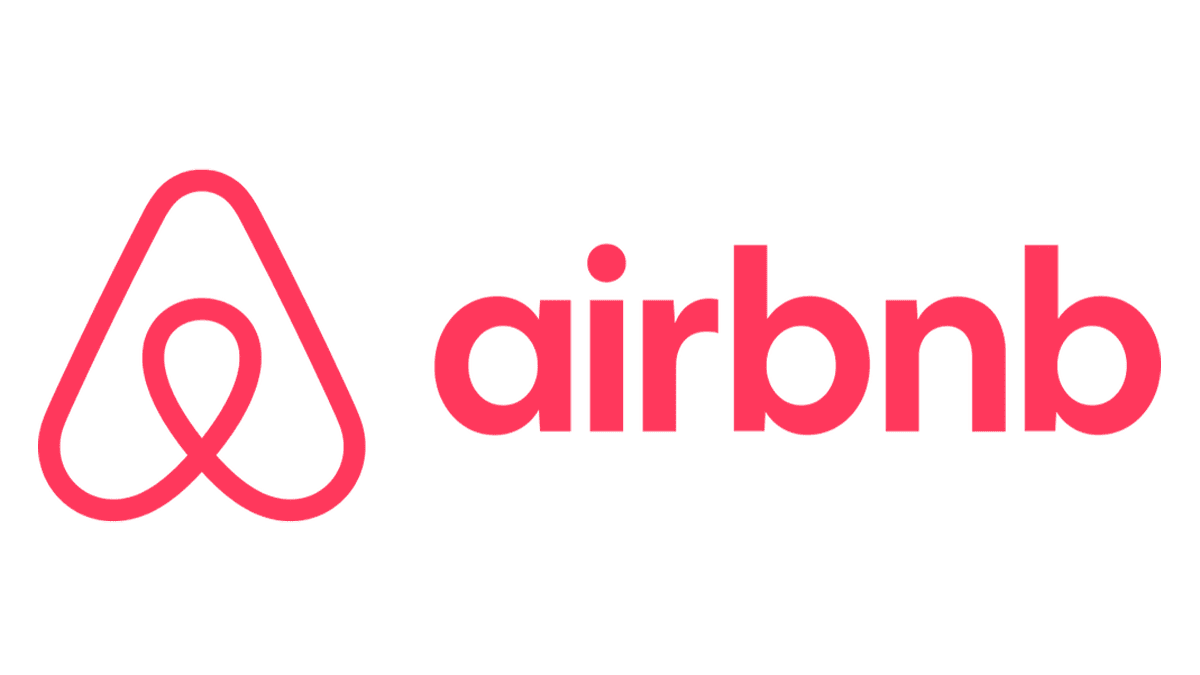 Airbnb logo: a red stylized symbol with 