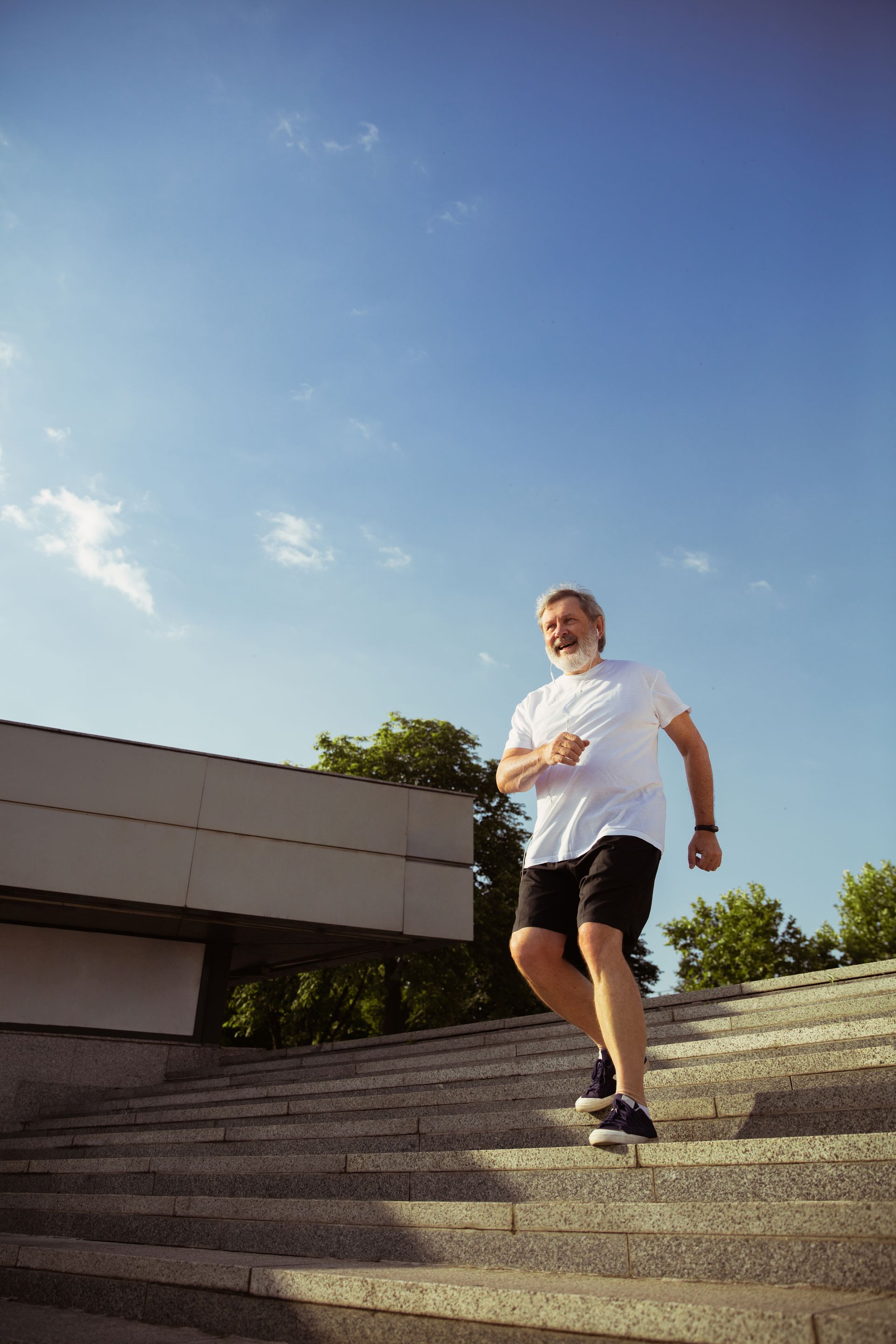 A man is running up a set of stairs.