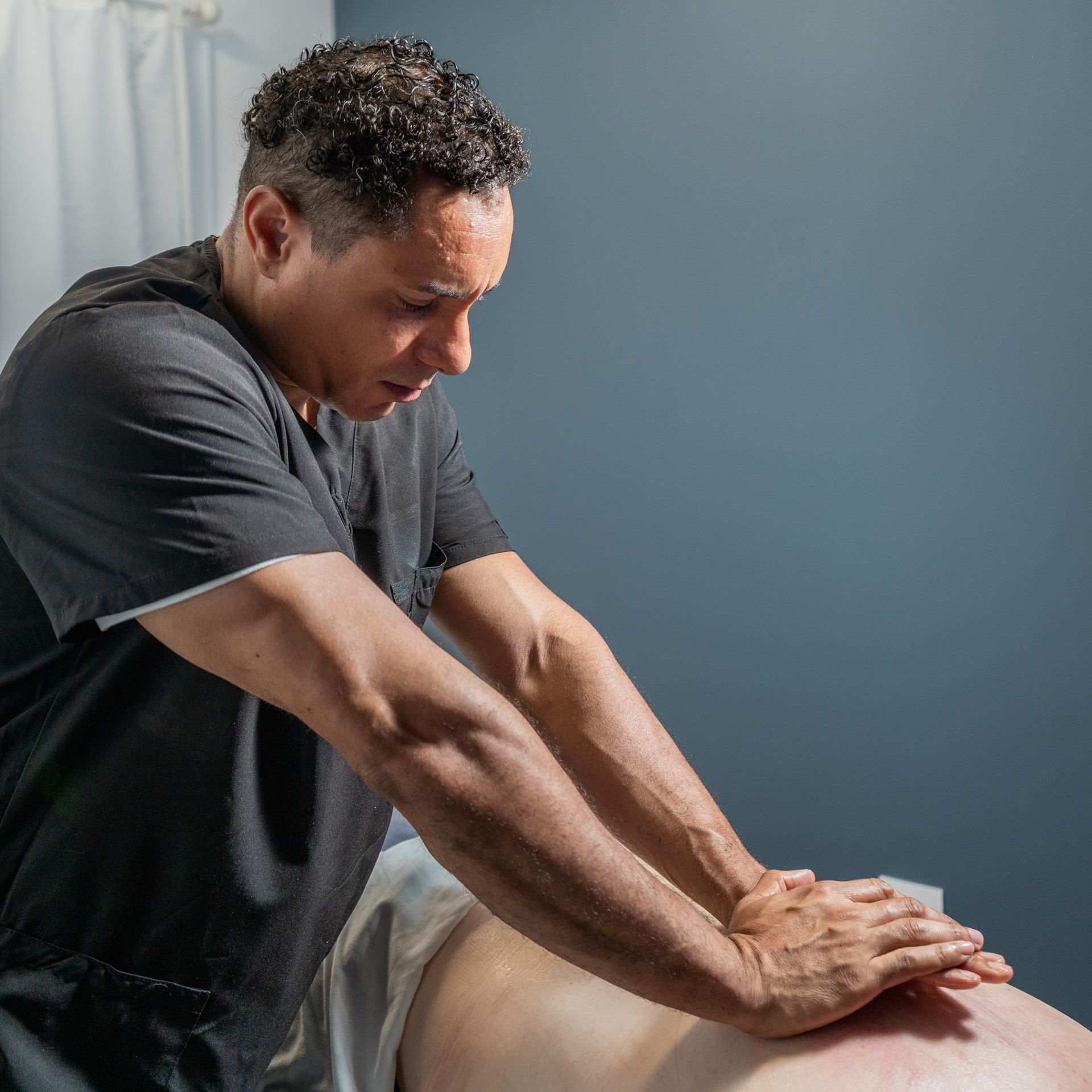 A man is giving a massage to a woman.