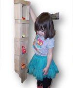 Little girl holding Shoe Rack —  Child learning center in Loomis, CA