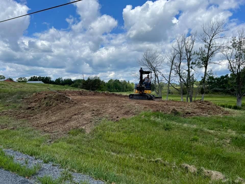 Large brick and stucco house with a circular driveway and manicured lawn.