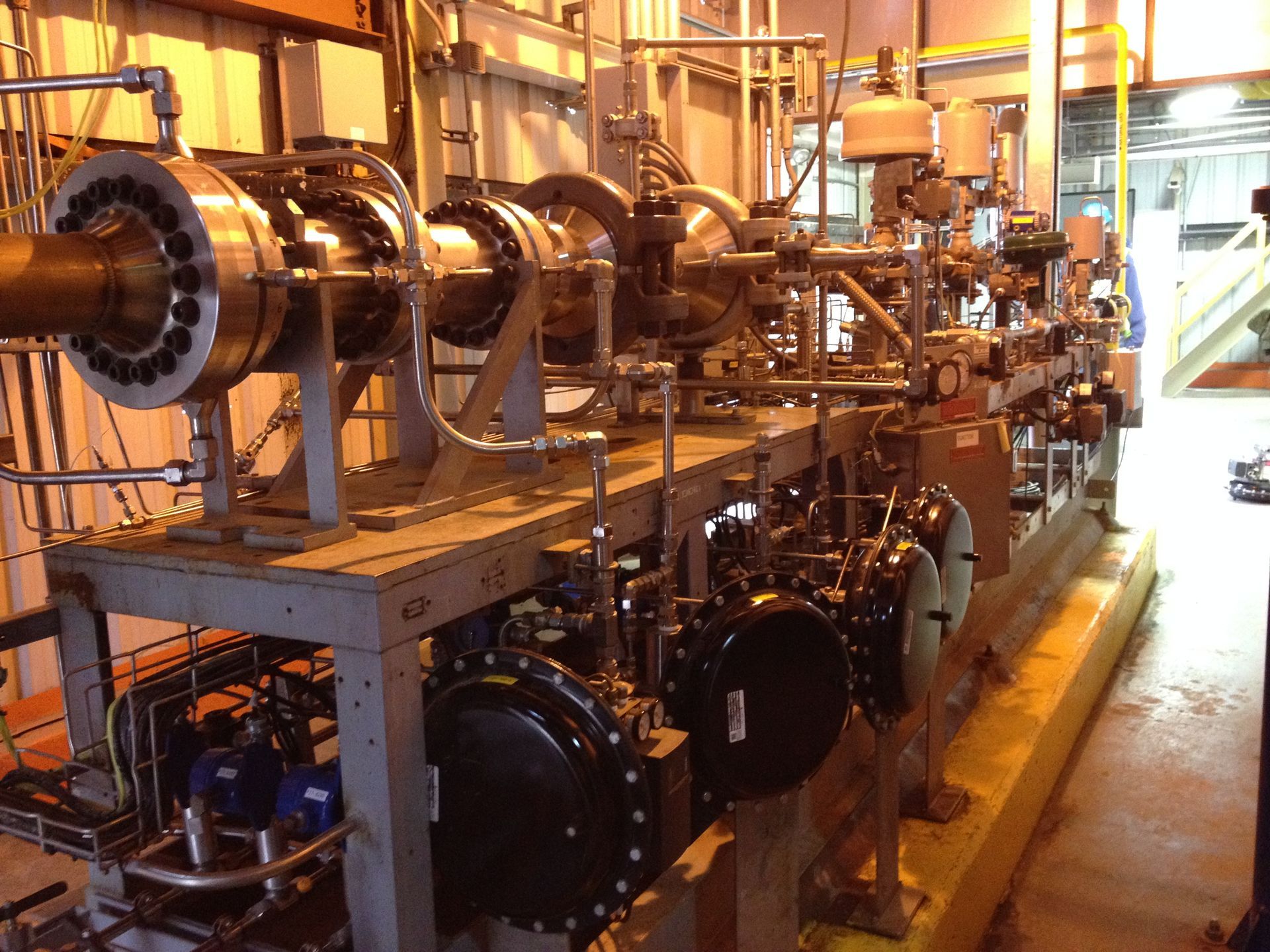 A bunch of pipes are lined up in a room