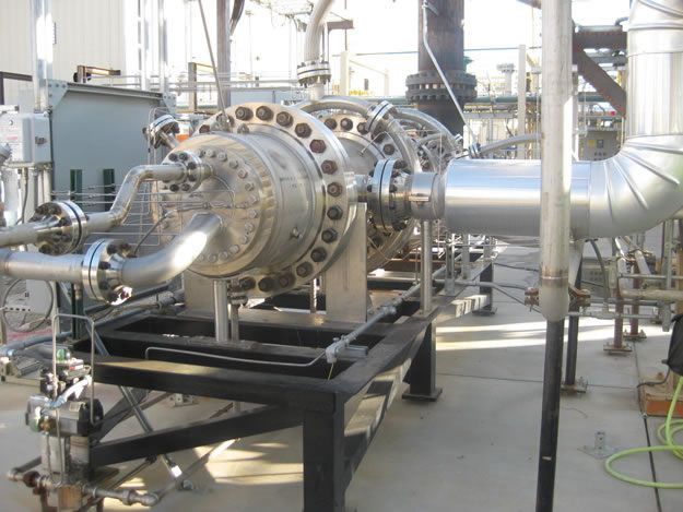 A bunch of pipes are lined up in a factory