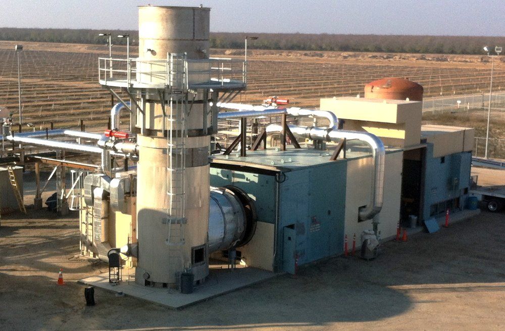 A large building with a lot of pipes coming out of it