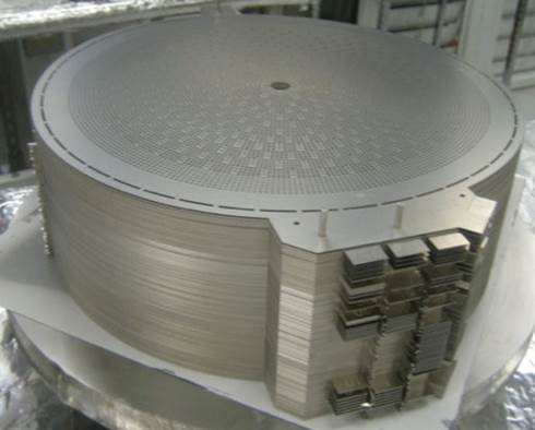A large metal object is sitting on top of a table