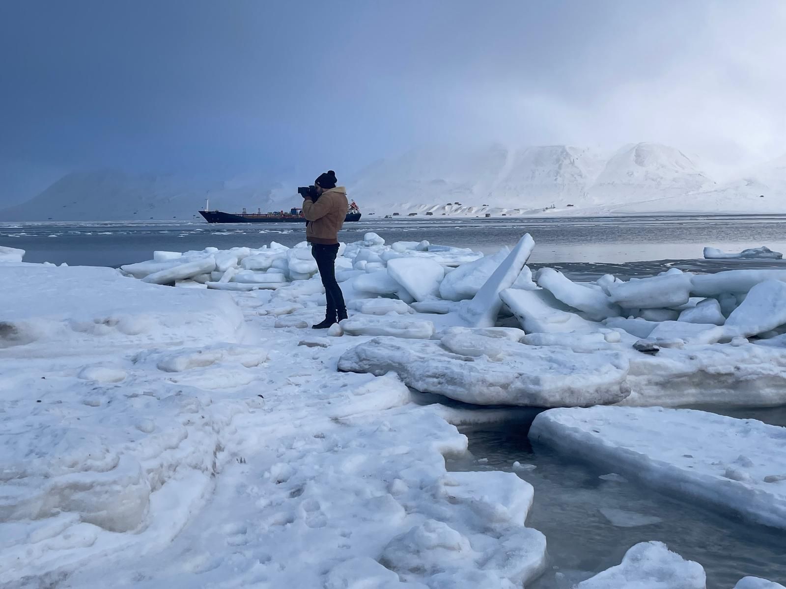 A group of people are sitting on a boat in the water.