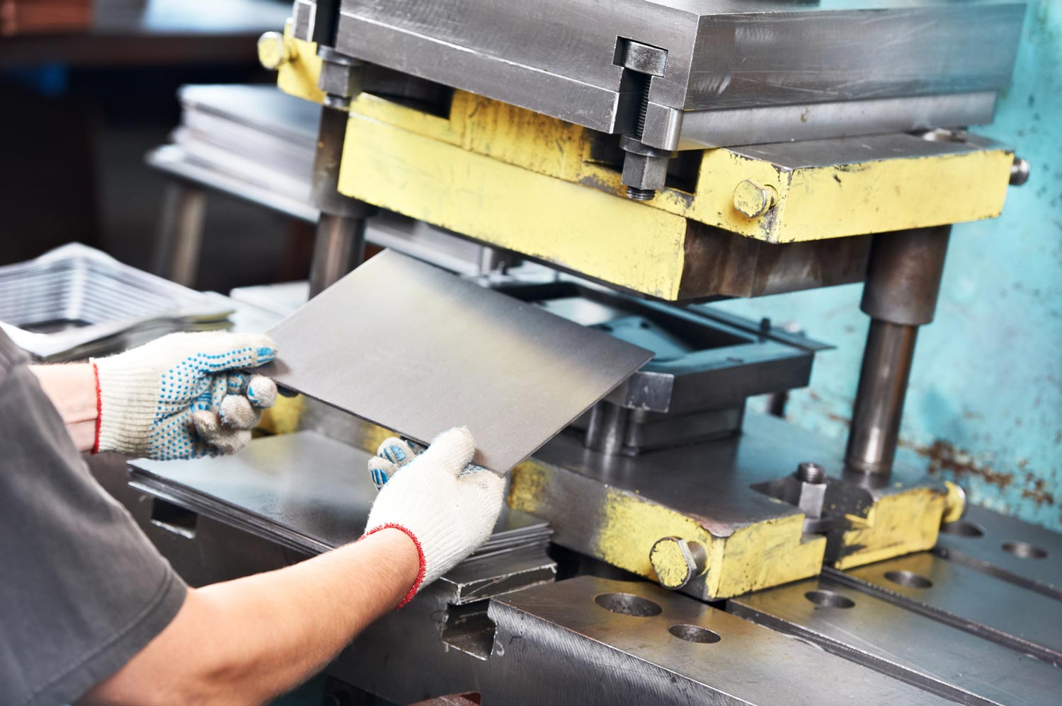 Worker Operating Metal Sheet Press Machine — Merrillville, IN — Northwest Indiana Fabrication LLC