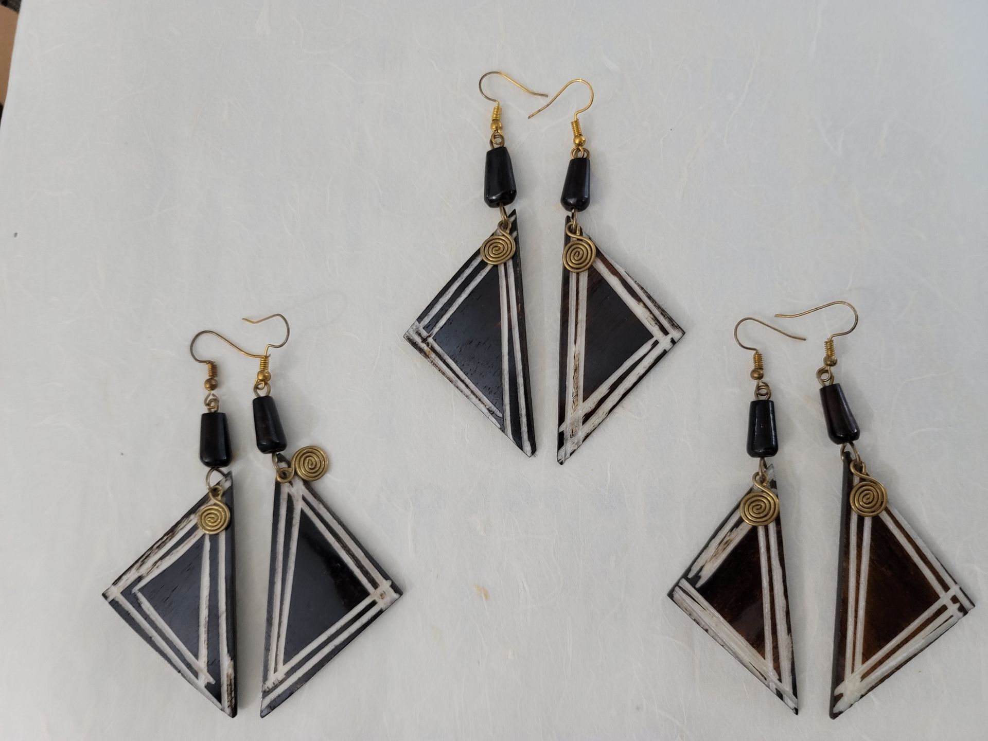 Ankole cow horn earrings, handmade bone earrings, ethical jewelry, African-inspired jewelry, artisan-crafted earrings, sustainable fashion accessories.