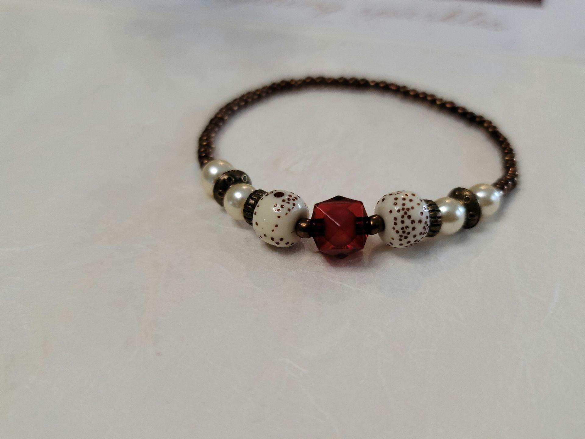 The simulated snake skin agate stone serves as the centerpiece, bringing a bold and unique texture that stands out.