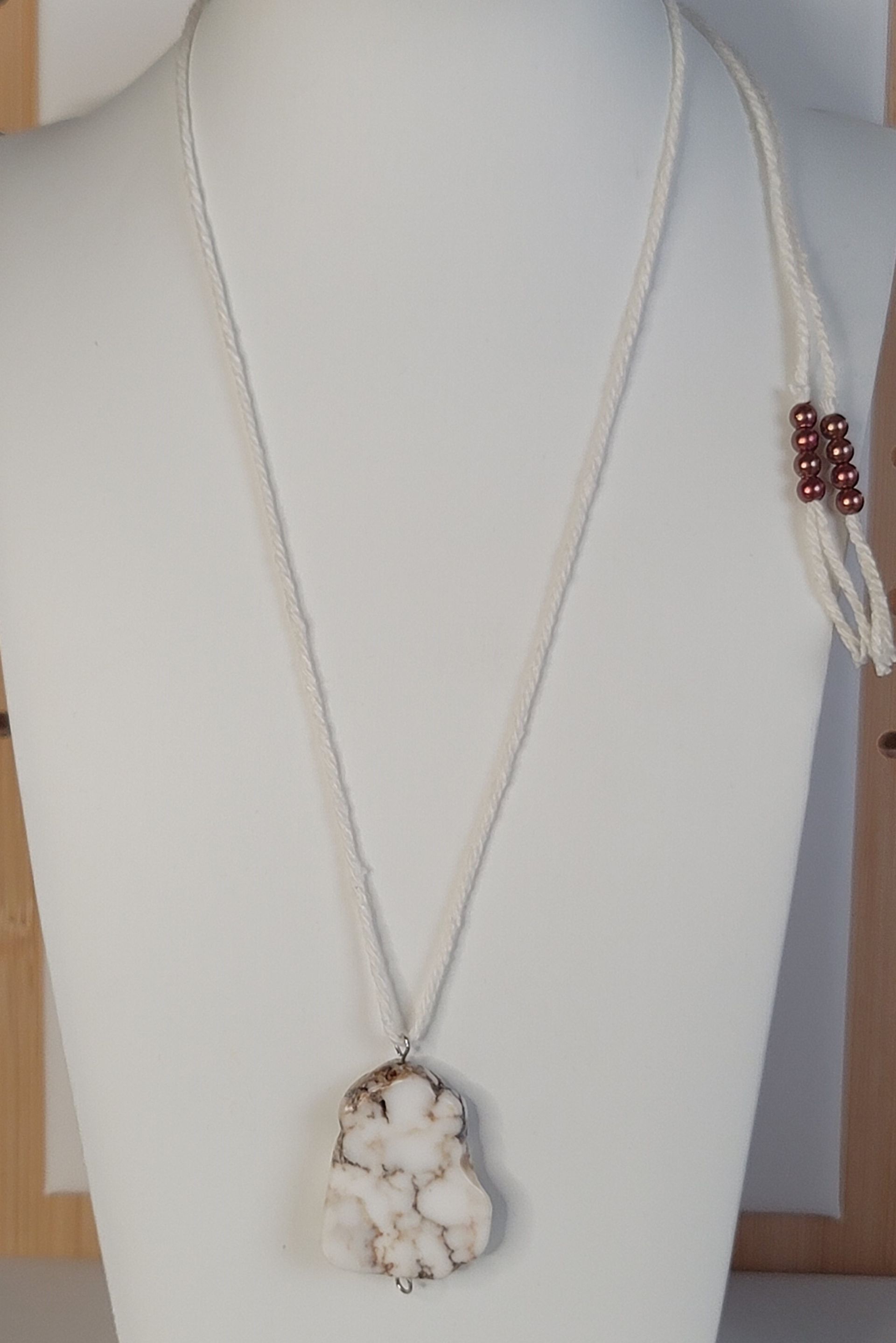 Add a touch of organic sophistication to your jewelry collection with this white granite stone lanyard necklace. Shop now!