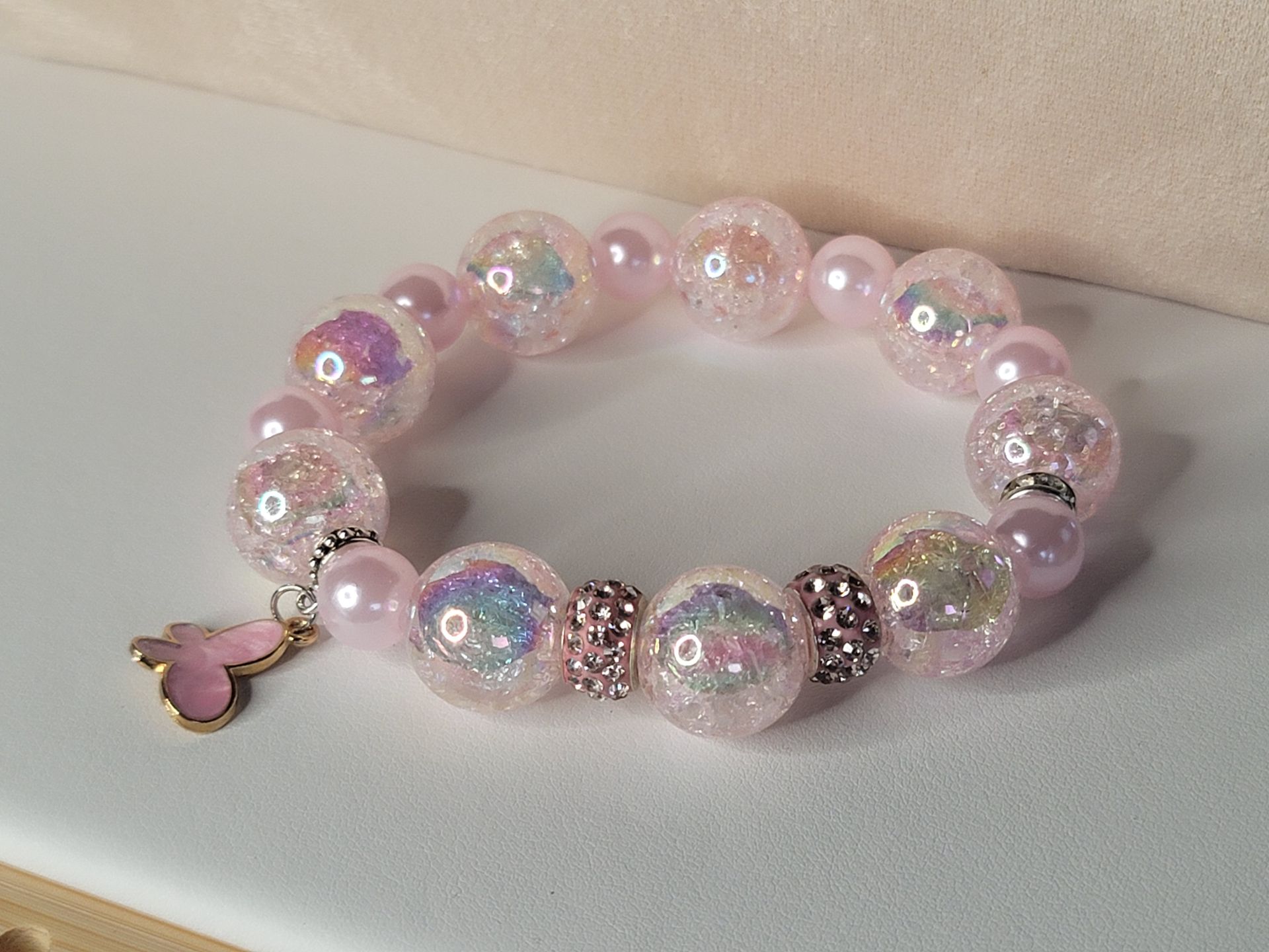 Elevate your accessory game with this chic pink, grey, and green beaded bracelet—a must-have for any jewelry lover. Shop now!