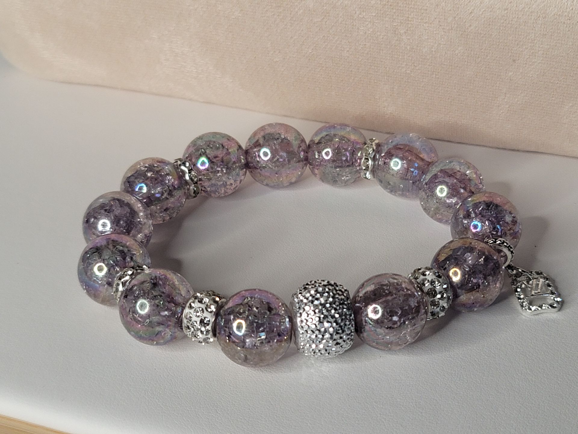 Elevate your accessory game with this chic pink, grey, and green beaded bracelet—a must-have for any jewelry lover. Shop now!