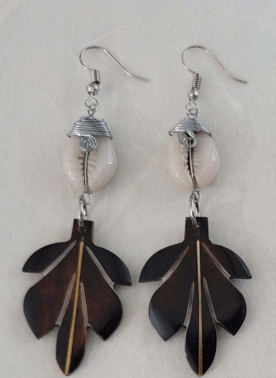 Ankole cow horn earrings, handmade bone earrings, ethical jewelry, African-inspired jewelry, artisan-crafted earrings, sustainable fashion accessories.