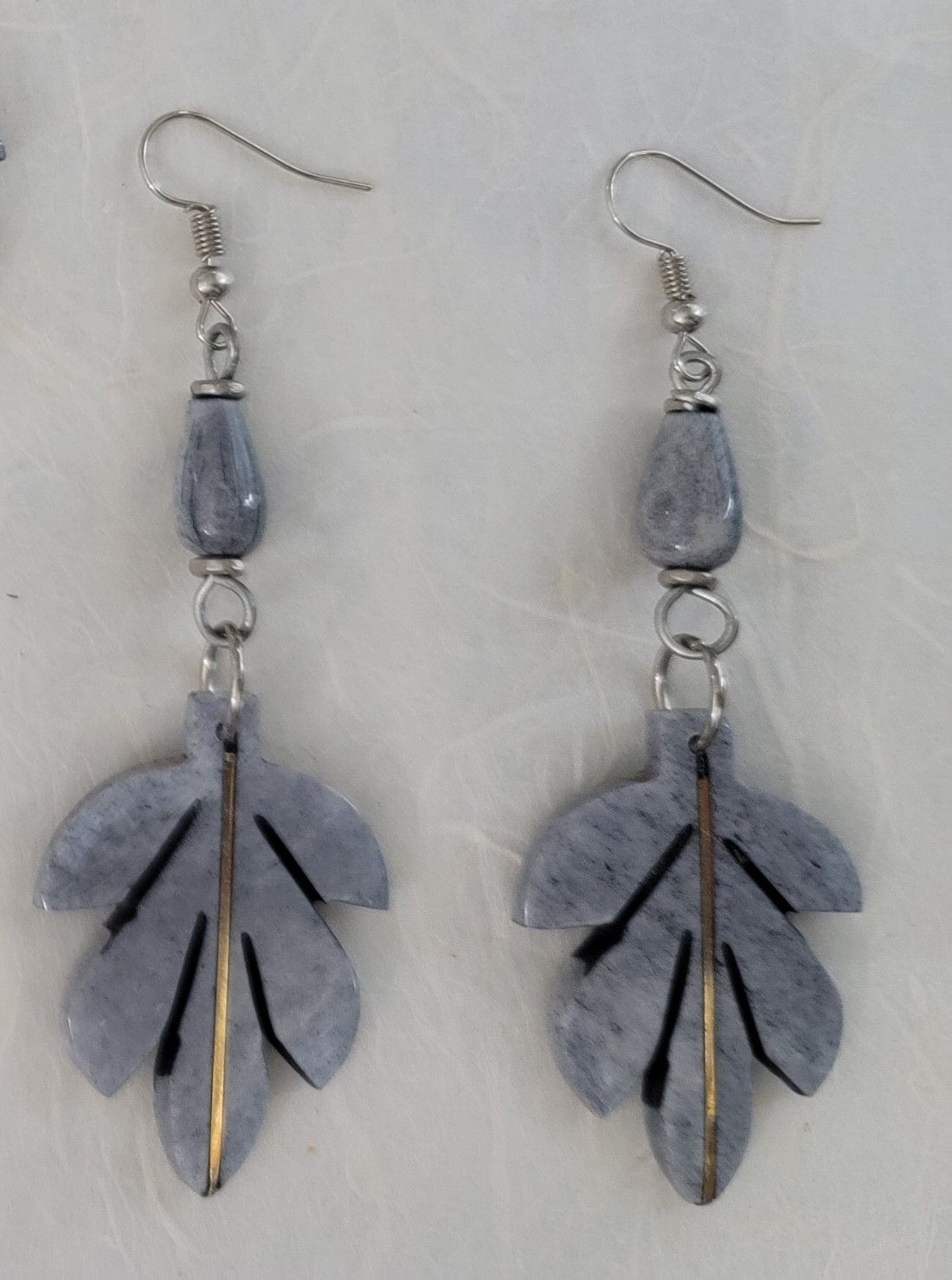 Ankole cow horn earrings, handmade bone earrings, ethical jewelry, African-inspired jewelry, artisan-crafted earrings, sustainable fashion accessories.