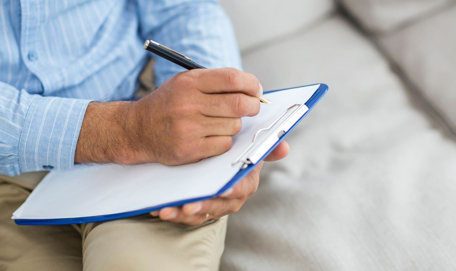 Professional writing on a clipboard