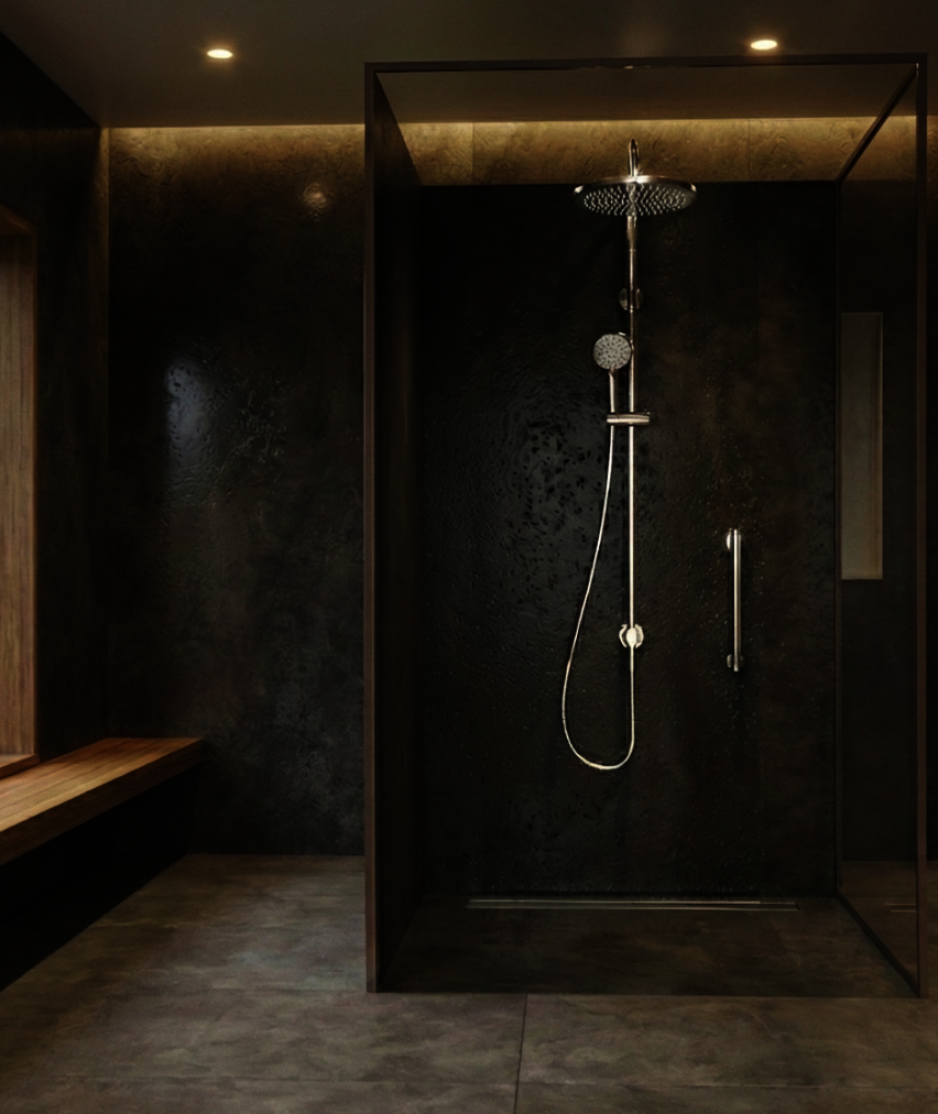 A modern walk-in shower with dark, textured stone walls, a rainfall showerhead, a handheld sprayer, and wood bench seating.