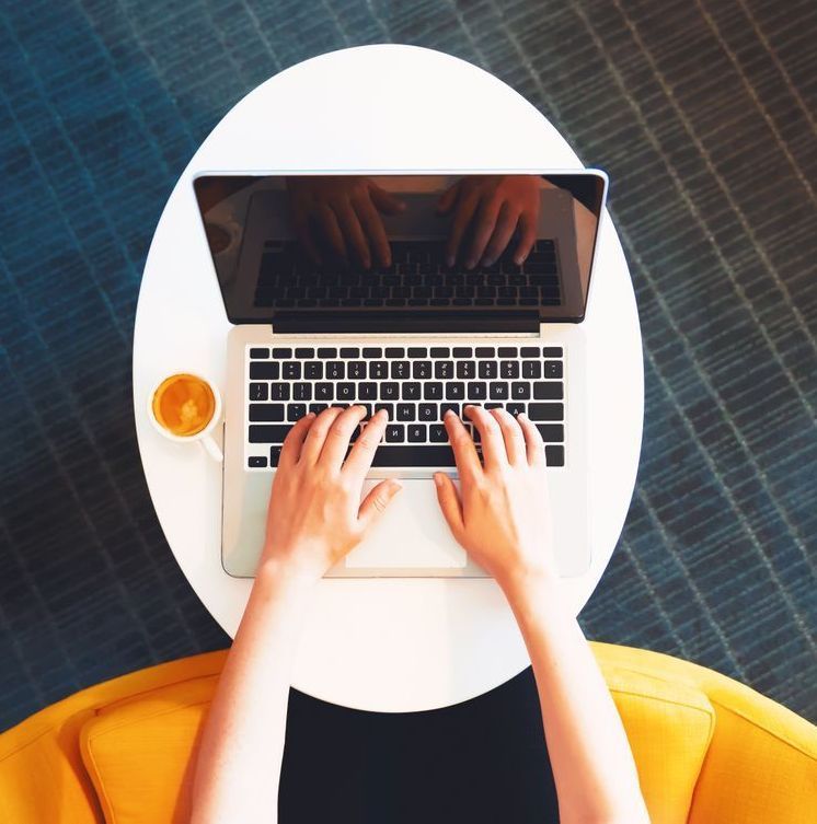 Using Laptop at a Cafe — Business IT Support Services in Port Macquarie, NSW