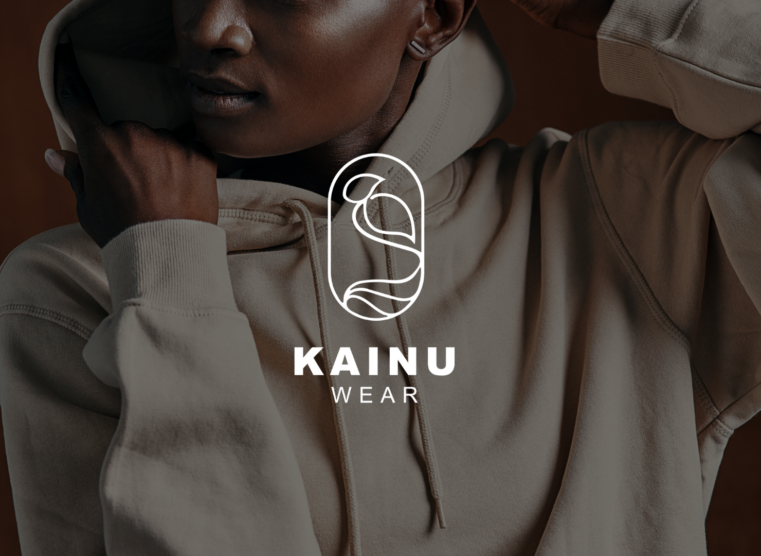 A woman is wearing a hoodie with a logo on it.