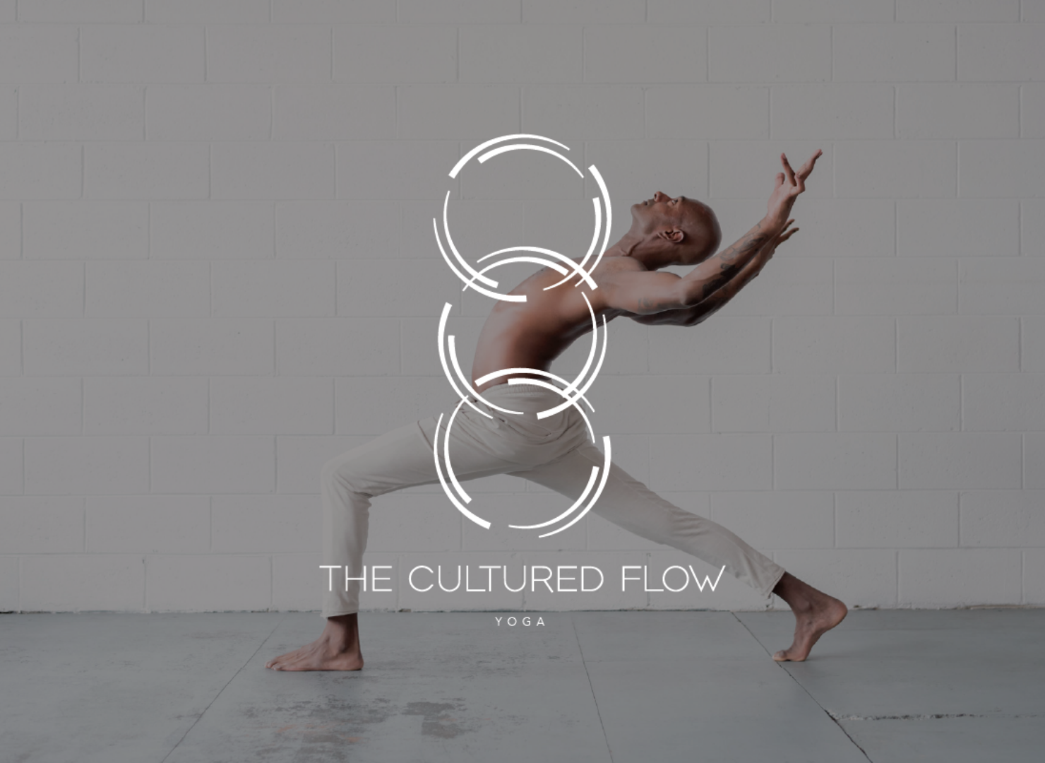 A man is doing a yoga pose for the cultured flow yoga