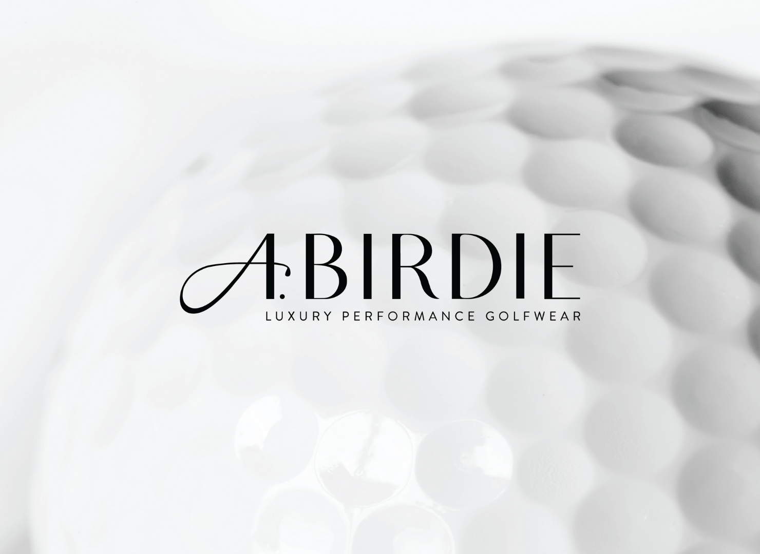 A close up of a birdie golf ball on a white background