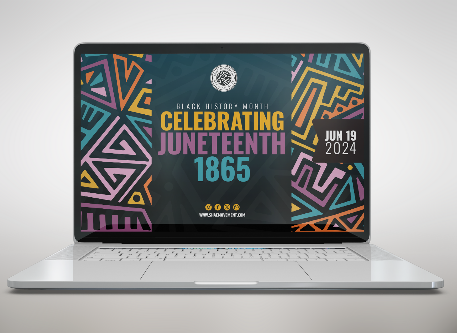 A laptop computer is open to a screen that says celebrating juneteenth 1865.