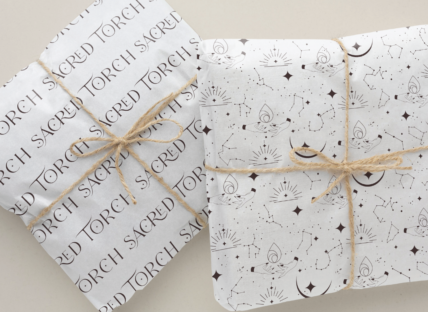 Two pieces of wrapping paper with the words sacred torch written on them