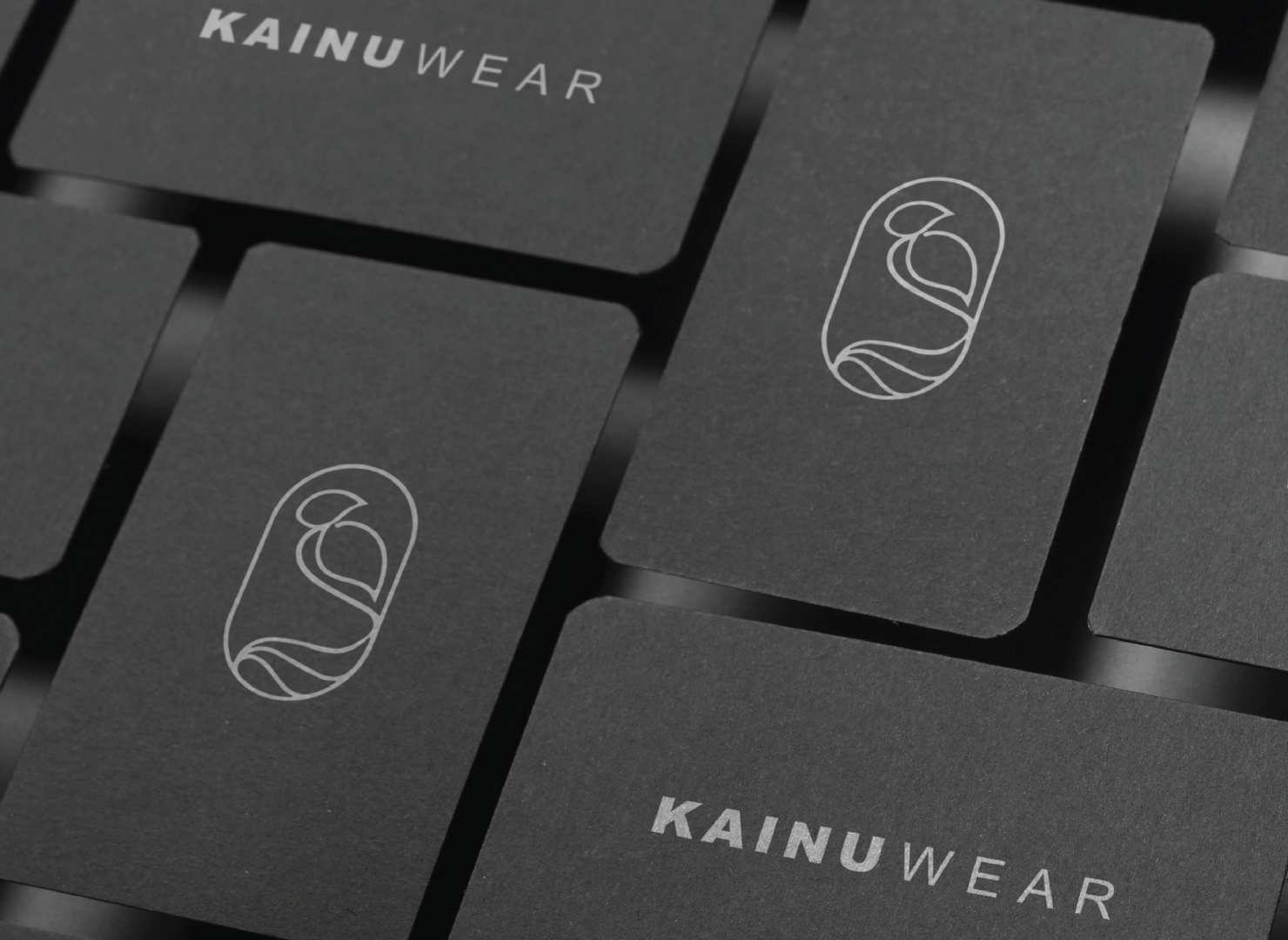 A close up of a business card for kainuwear