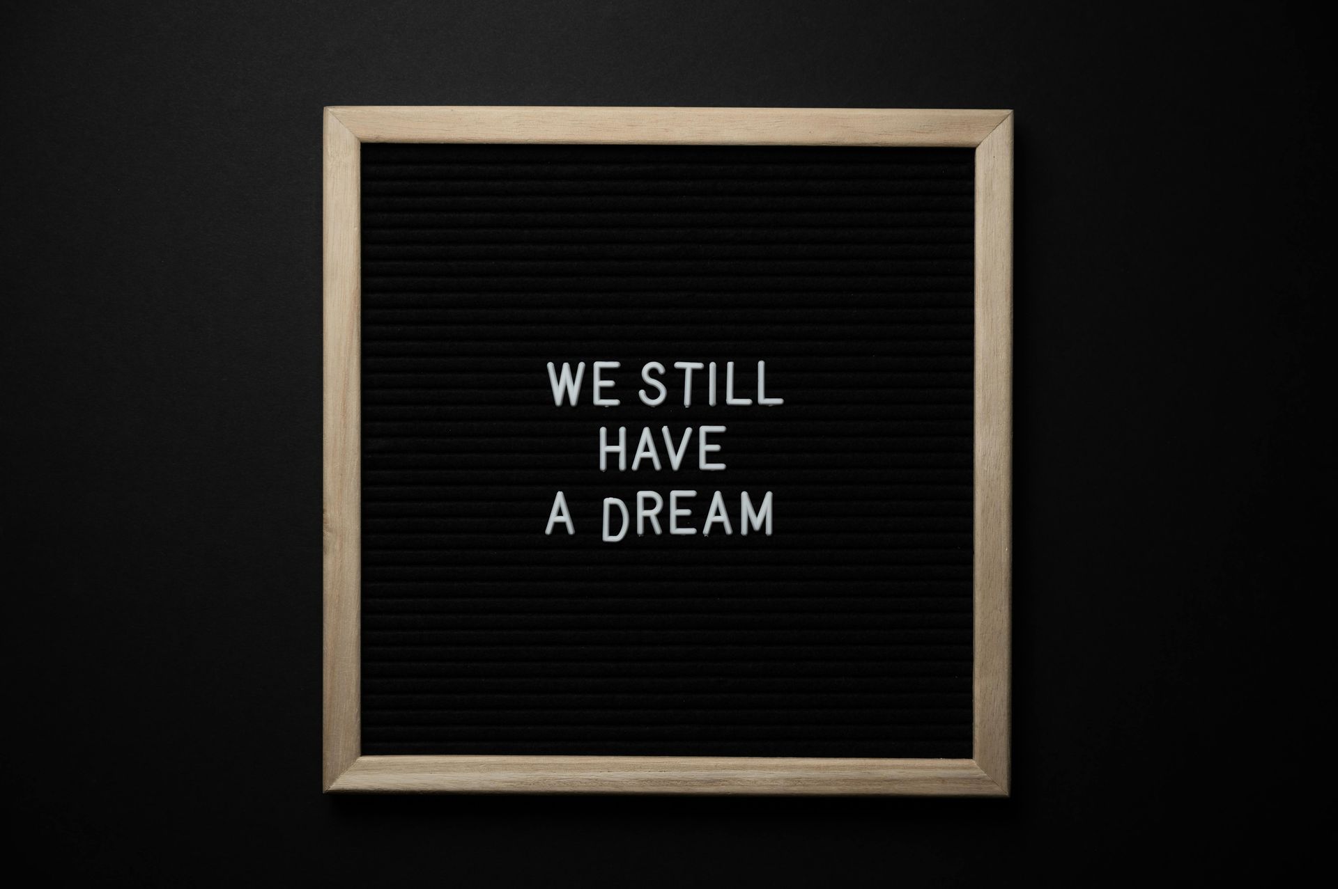 A blackboard with the words `` we still have a dream '' written on it.