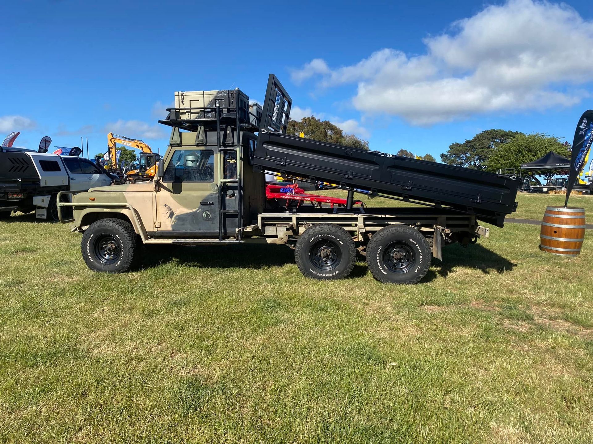 A Man is Working on a Blue Metal Frame in a Garage — Deveigne Fabrications In Brocklehurst, NSW