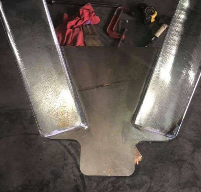 A Metal Object is Sitting on Top of a Table Next to Tools — Deveigne Fabrications In Brocklehurst, NSW