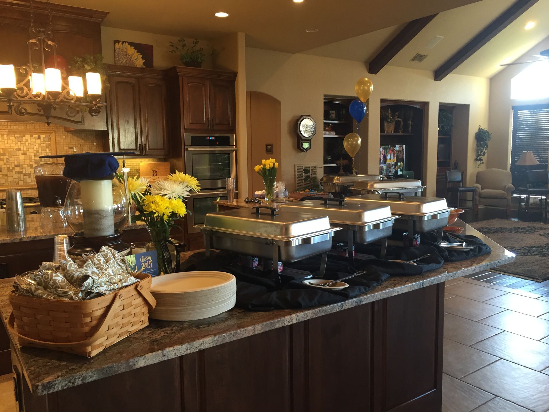 A kitchen with a bunch of buffet trays on the counter