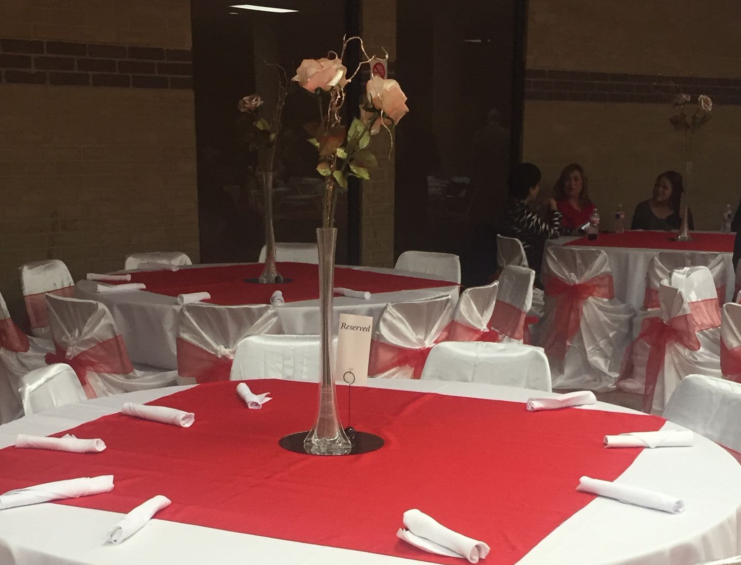 A table with a vase of flowers on it