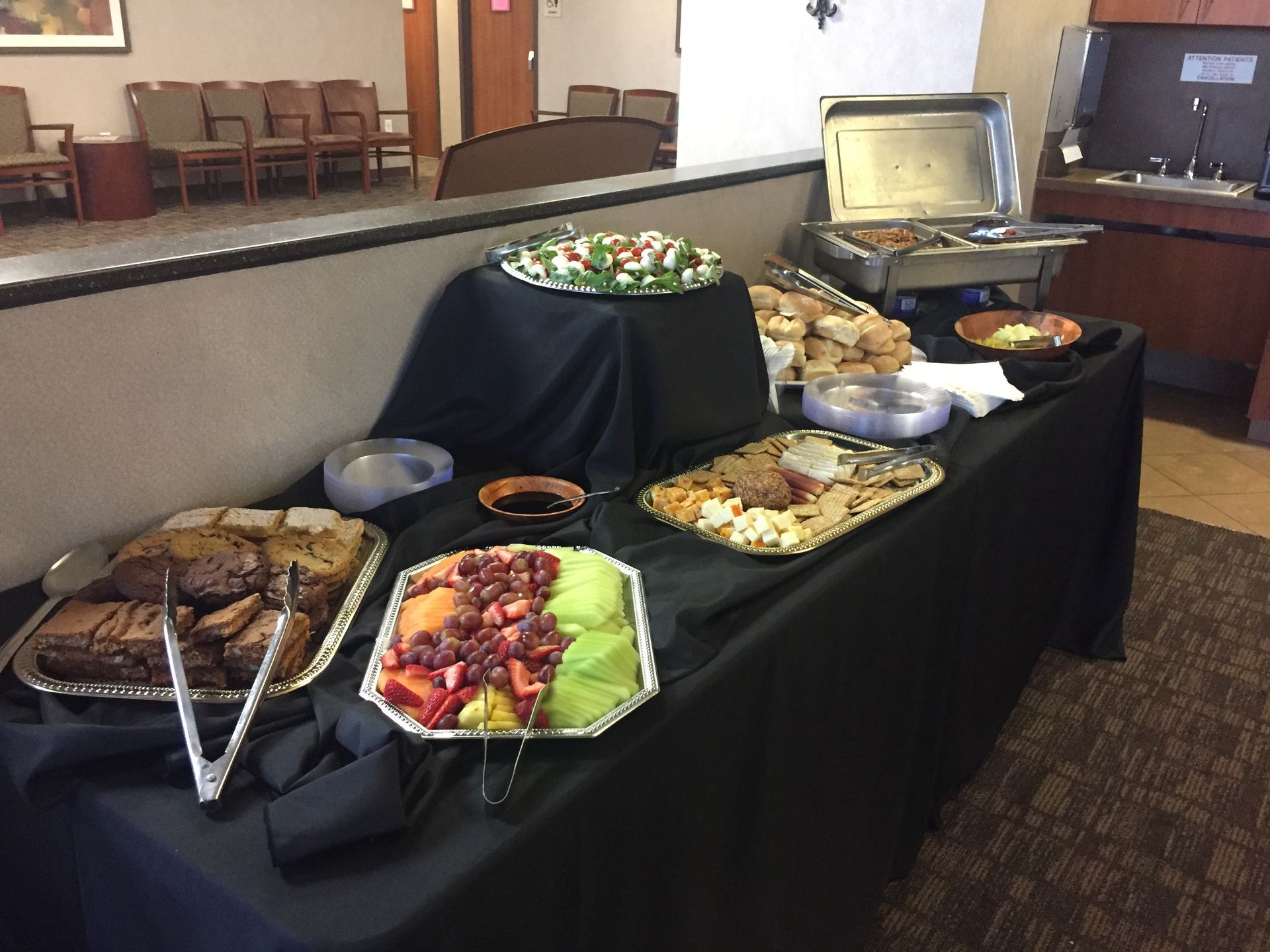 A buffet table with a variety of food on it