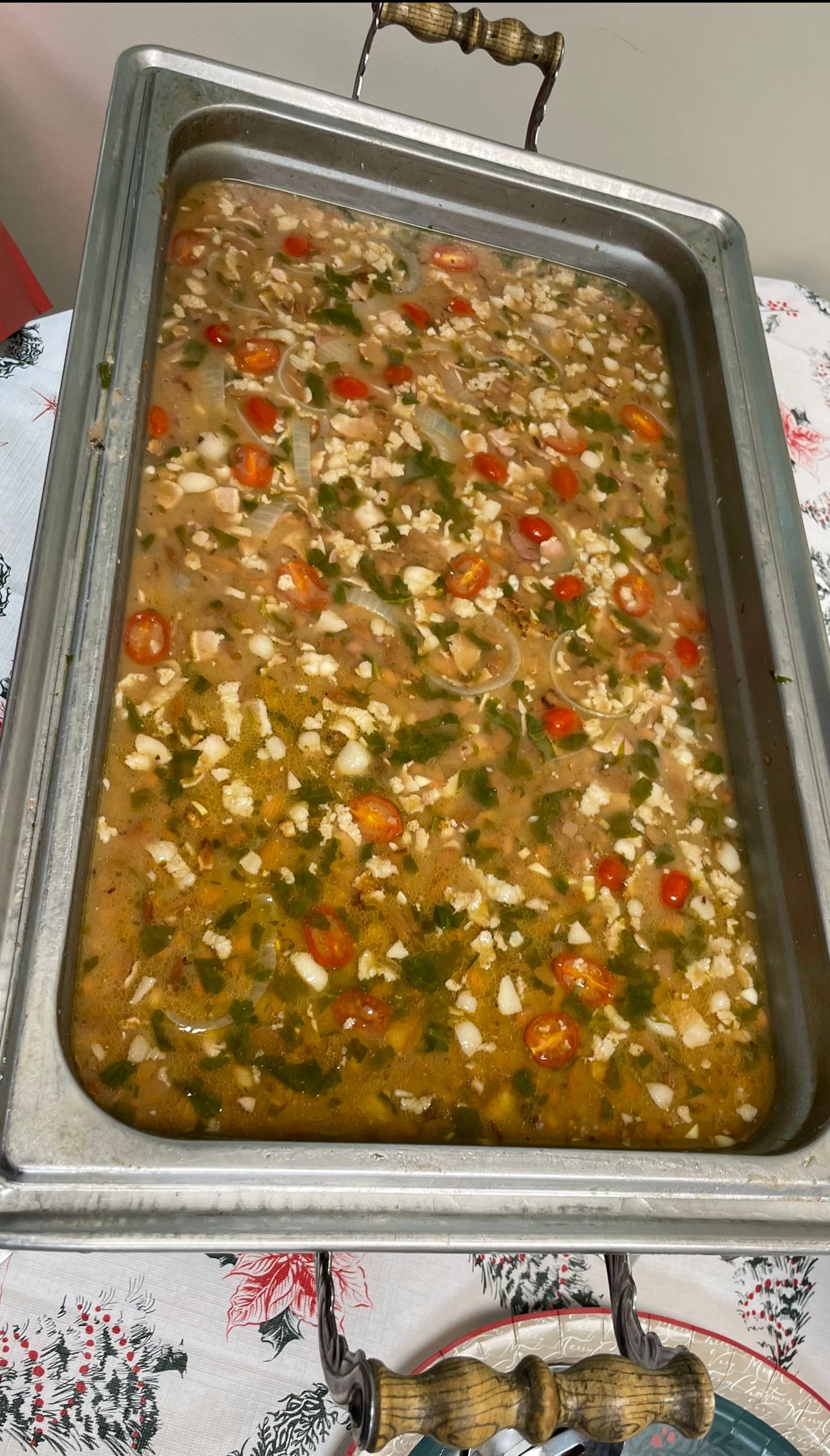A large tray of food is sitting on a table.