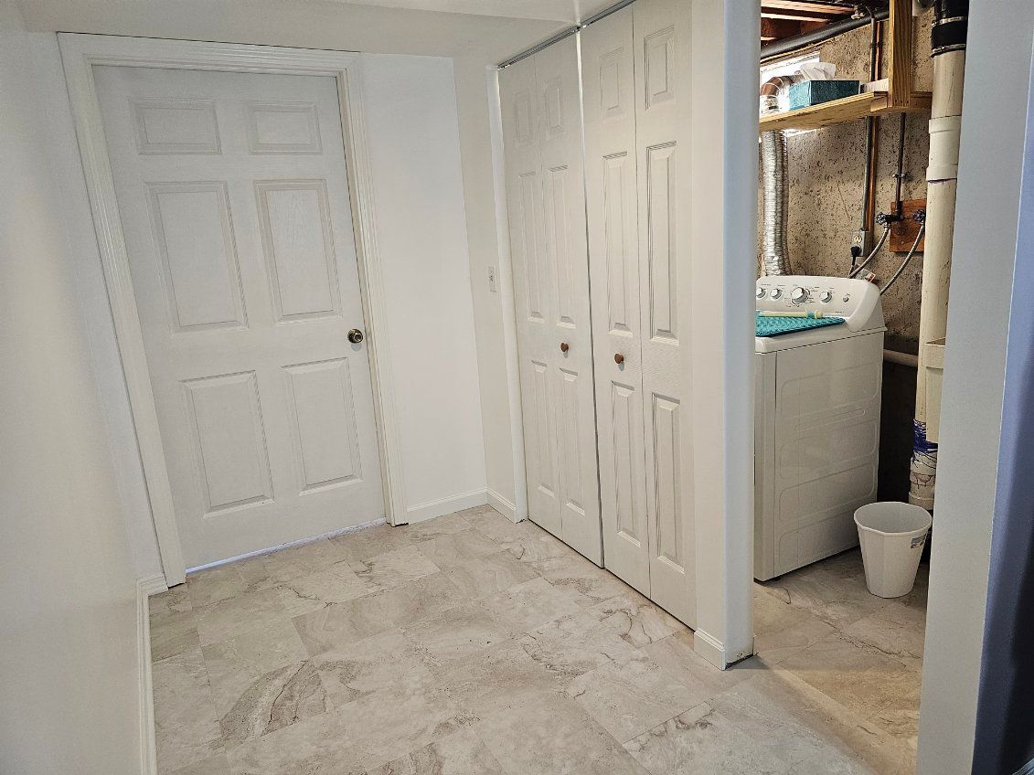 There is a washer and dryer in the laundry room.