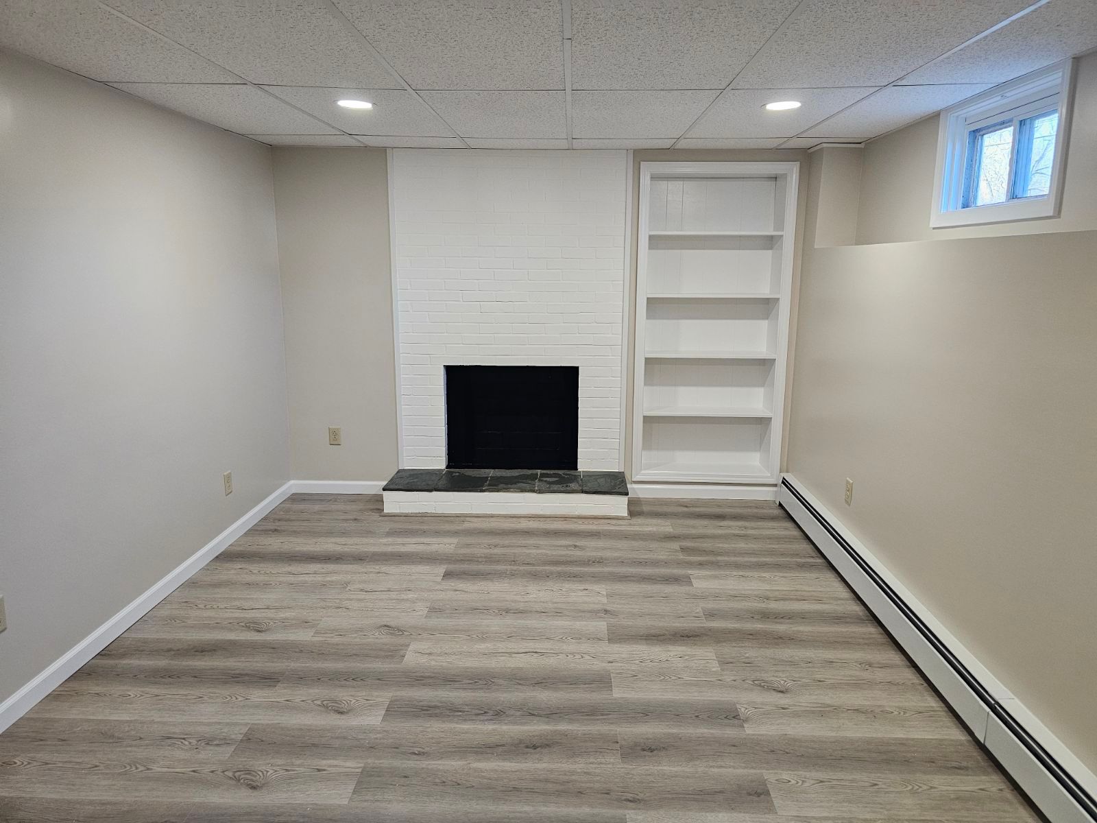 There is a fireplace in the middle of the room.