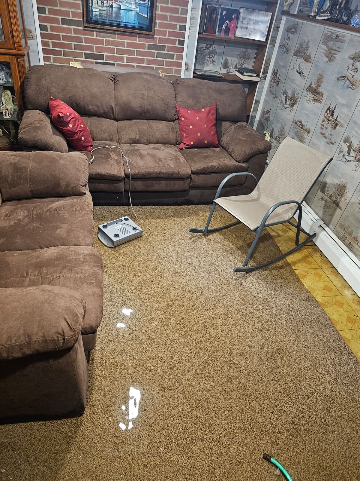 A living room filled with furniture and a rocking chair.