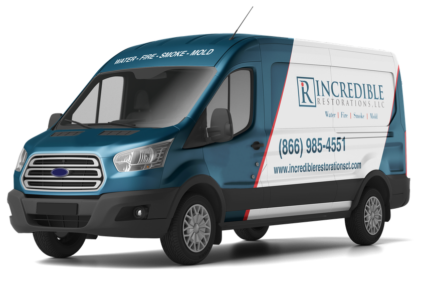 A blue and white van is parked on a white surface.