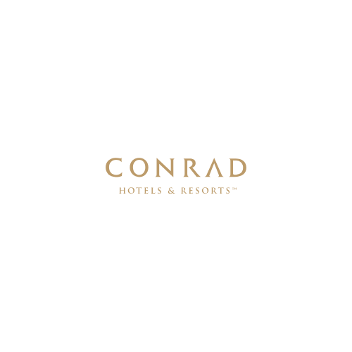 Conrad Hotels & Resorts logo in gold font on a white background.