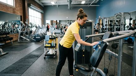 Cleaner wiping and sanitizing fitness equipment surfaces and machine touchpoints Minnetonka, MN