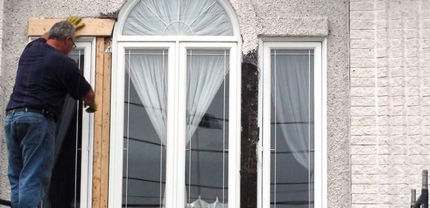 four clean white windows with white blinds