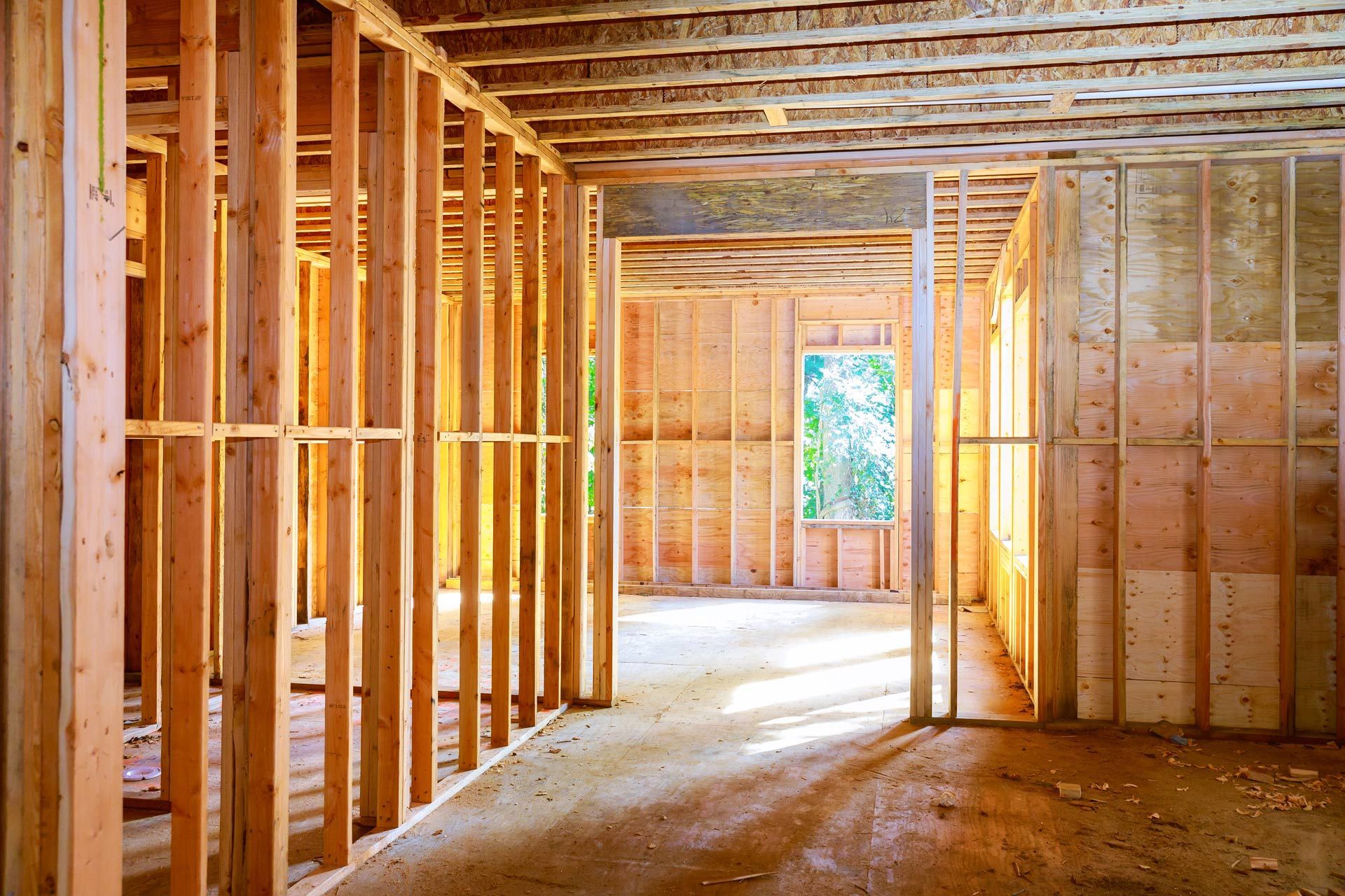 The inside of a house under construction with wooden beams