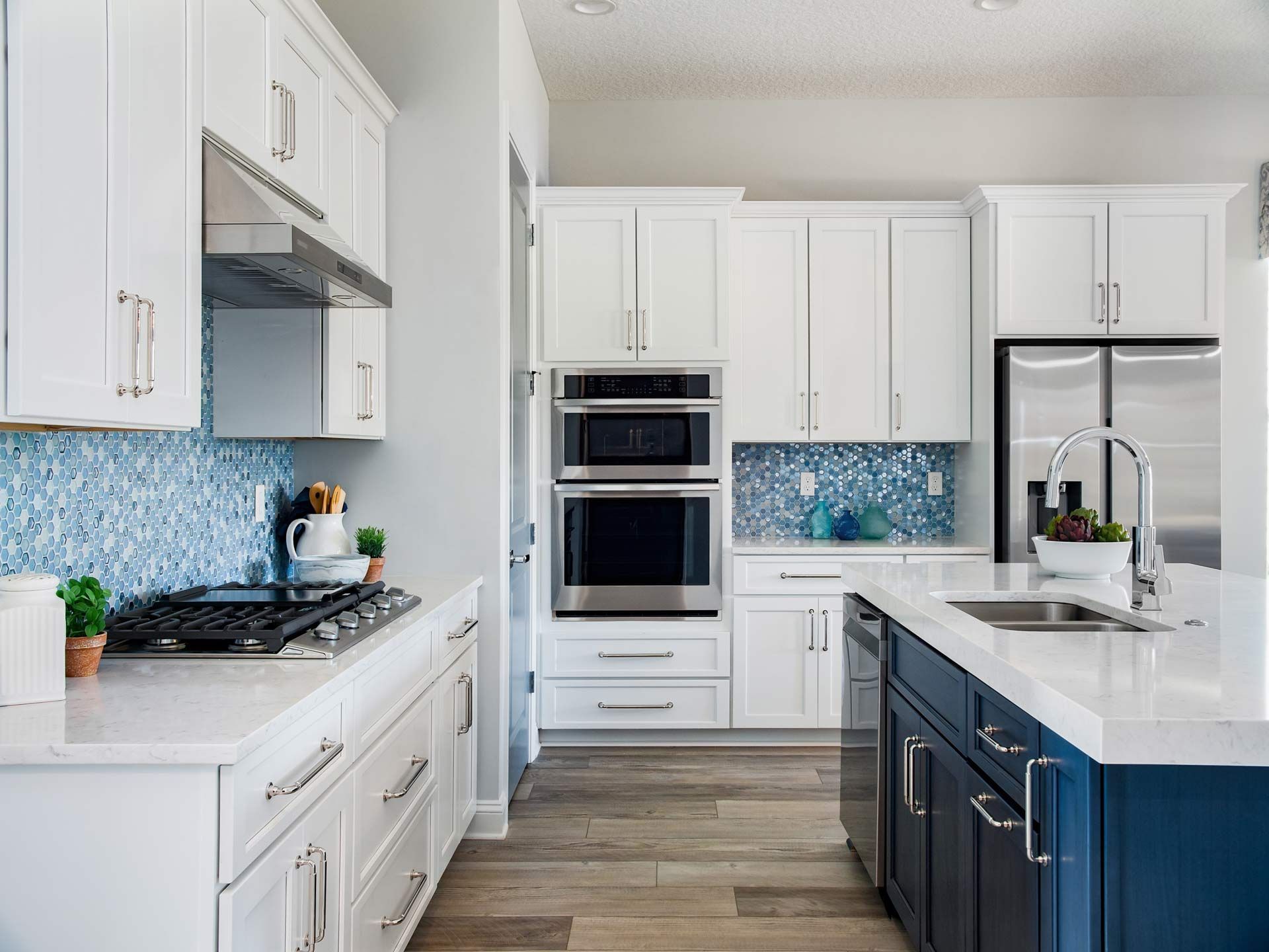 A kitchen with white cabinets