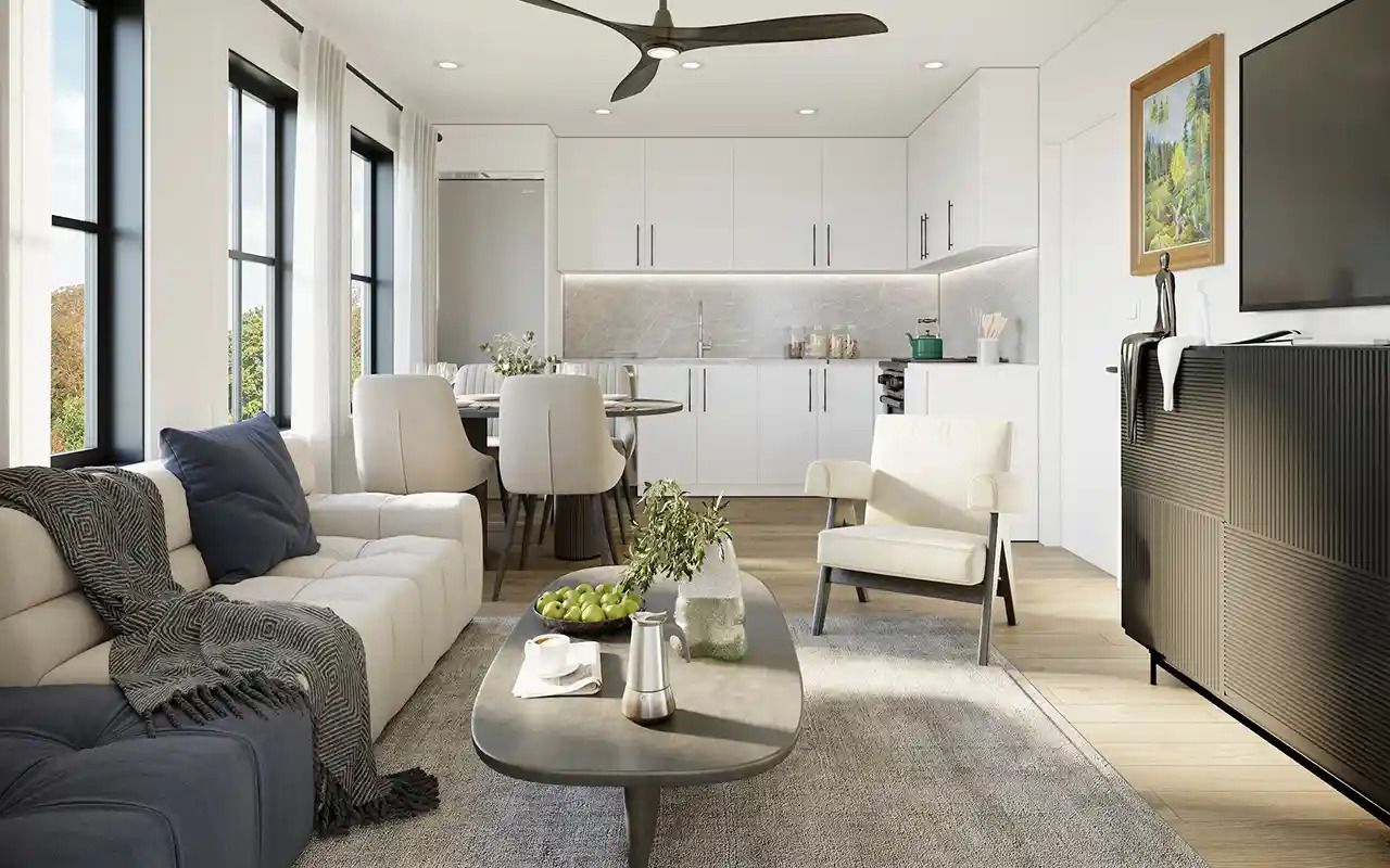 Home Renovation Service: A bright open-plan living room with a white sofa, cream armchair, coffee table, and kitchen in the background.