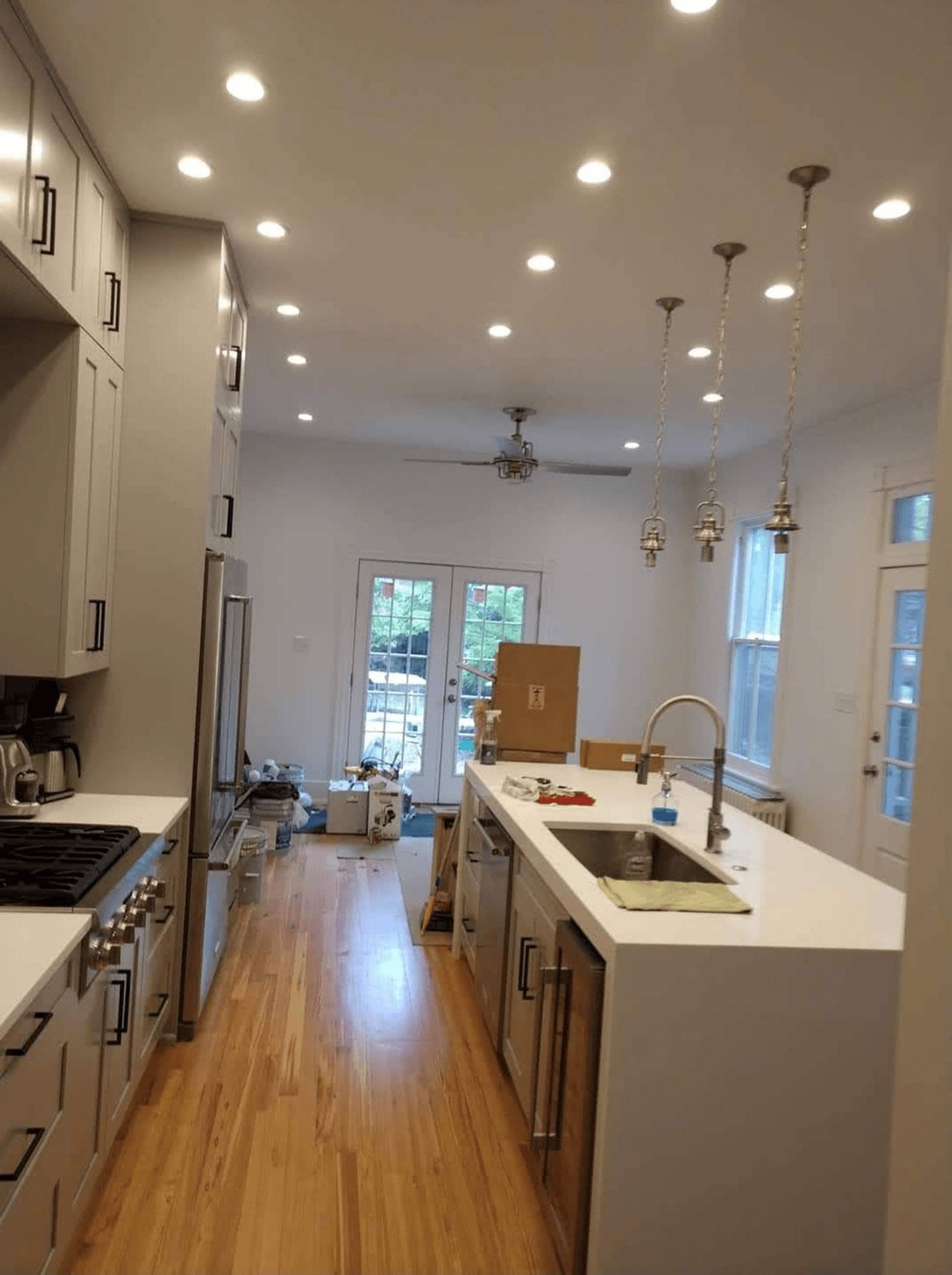 A kitchen with white cabinets
