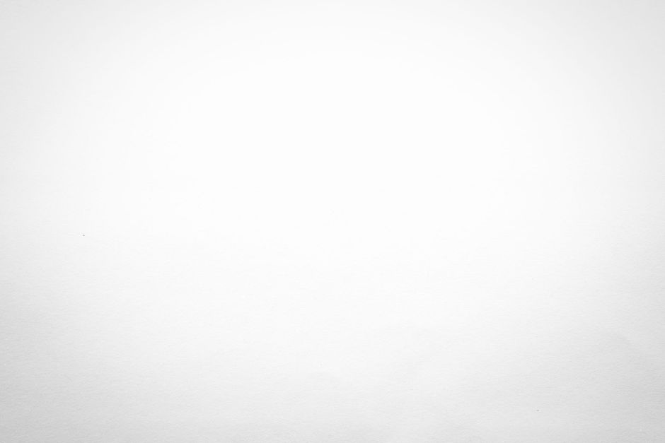A close up of a white background with a gray gradient.