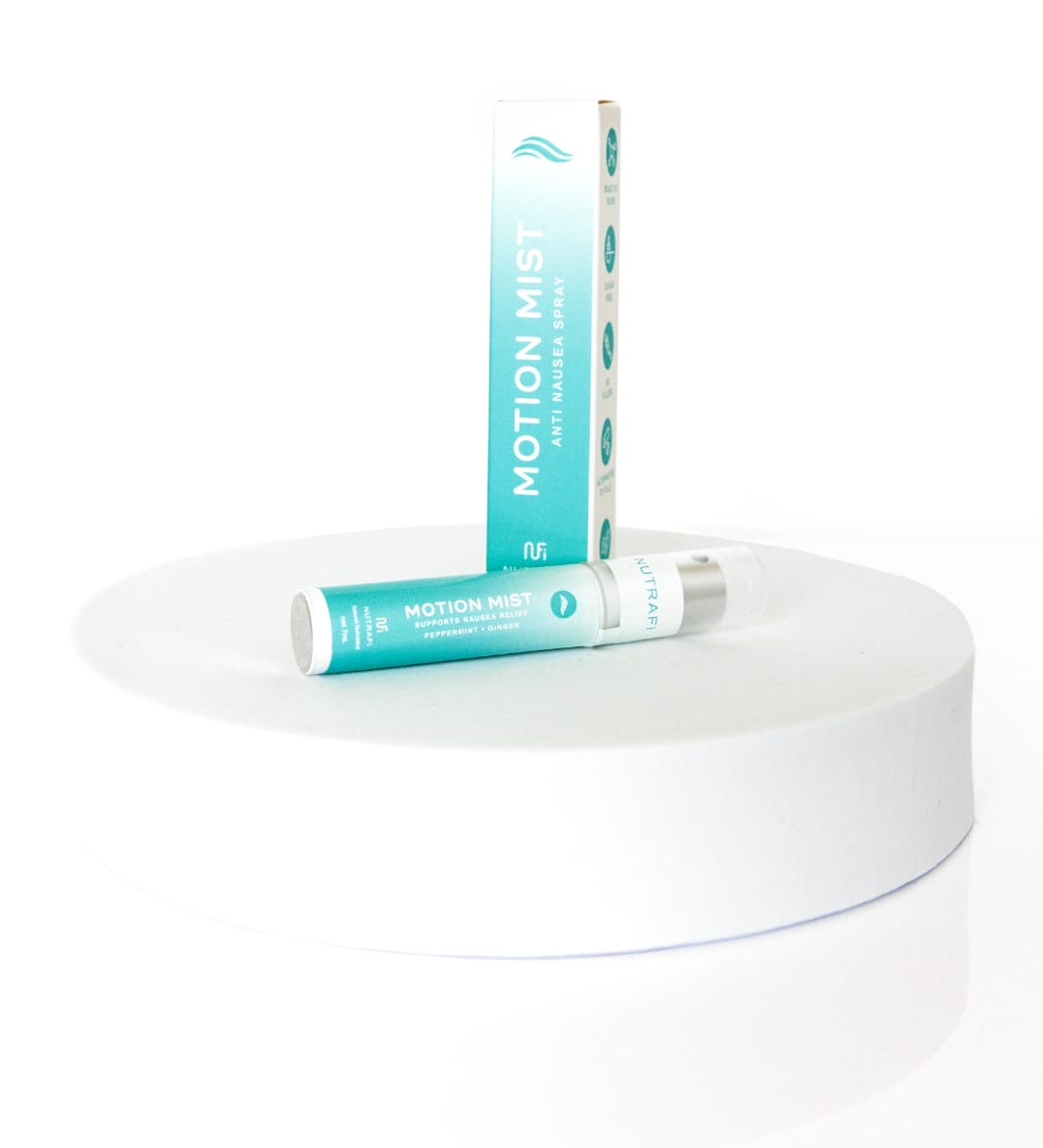 Motion Mist product shot; turquoise and white spray bottle and box on a white pedestal.